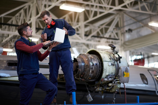 Two men in aerospace service uniforms